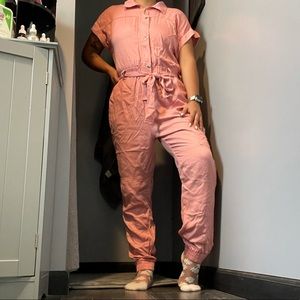 Pink jumpsuit, silver bottoms, short sleeves